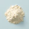 Biologische tarwegluten los op lichtblauwe achtergrond
