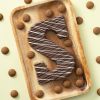 Chocoladeletter S melk swirl (200 gram) met kruidnoten